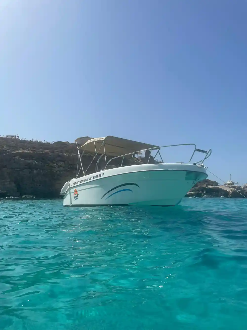 A moored boat in bright turquoise water