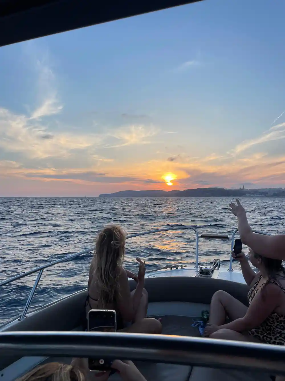 Sunset over the sea from the boat