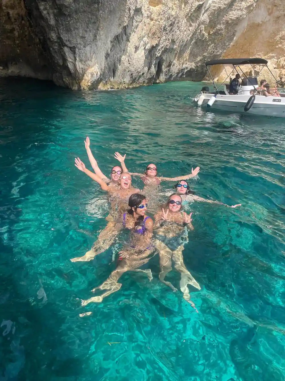 Swimmers floating together in clear water