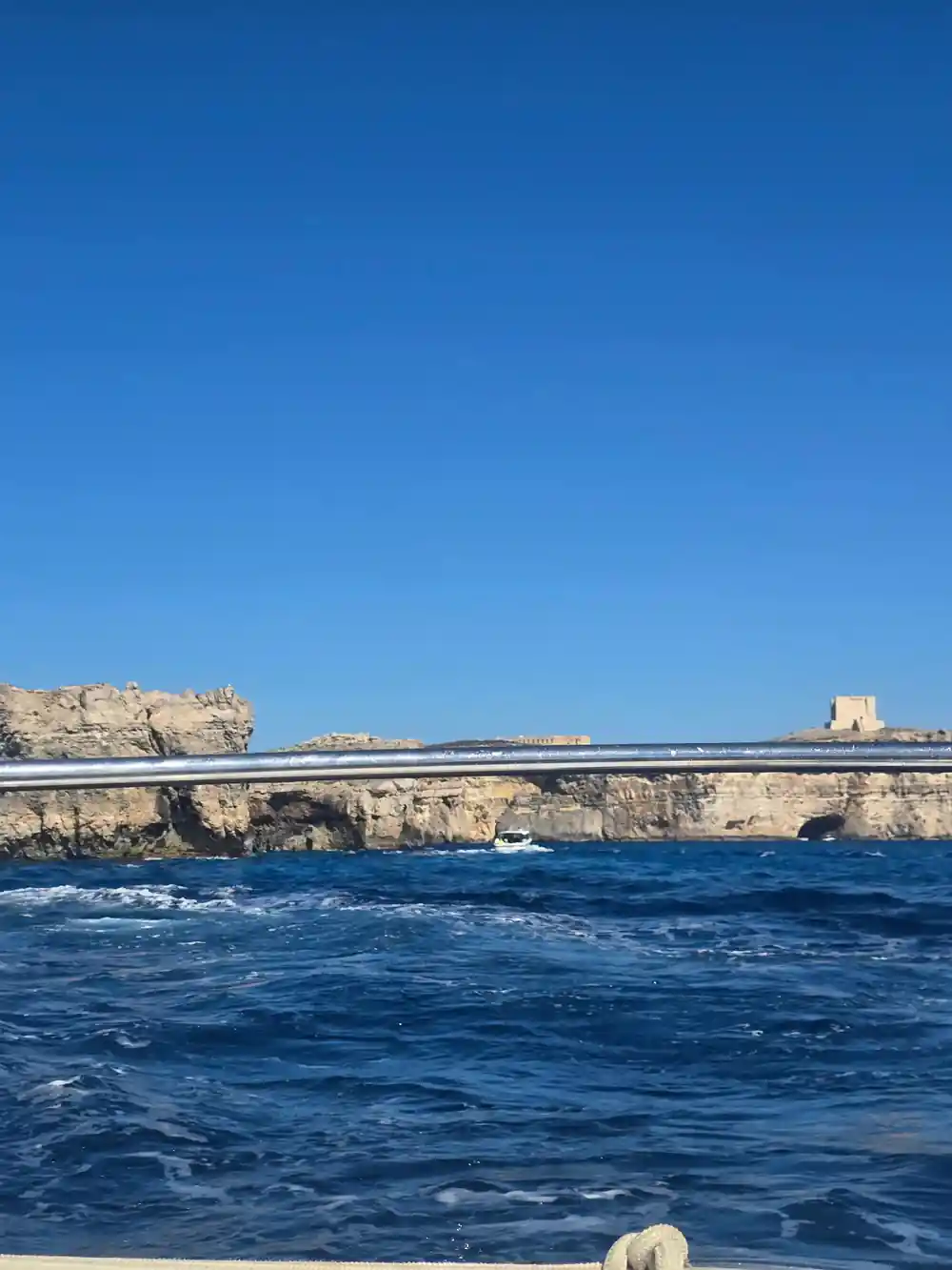 The watchtower on the cliff seen across the water